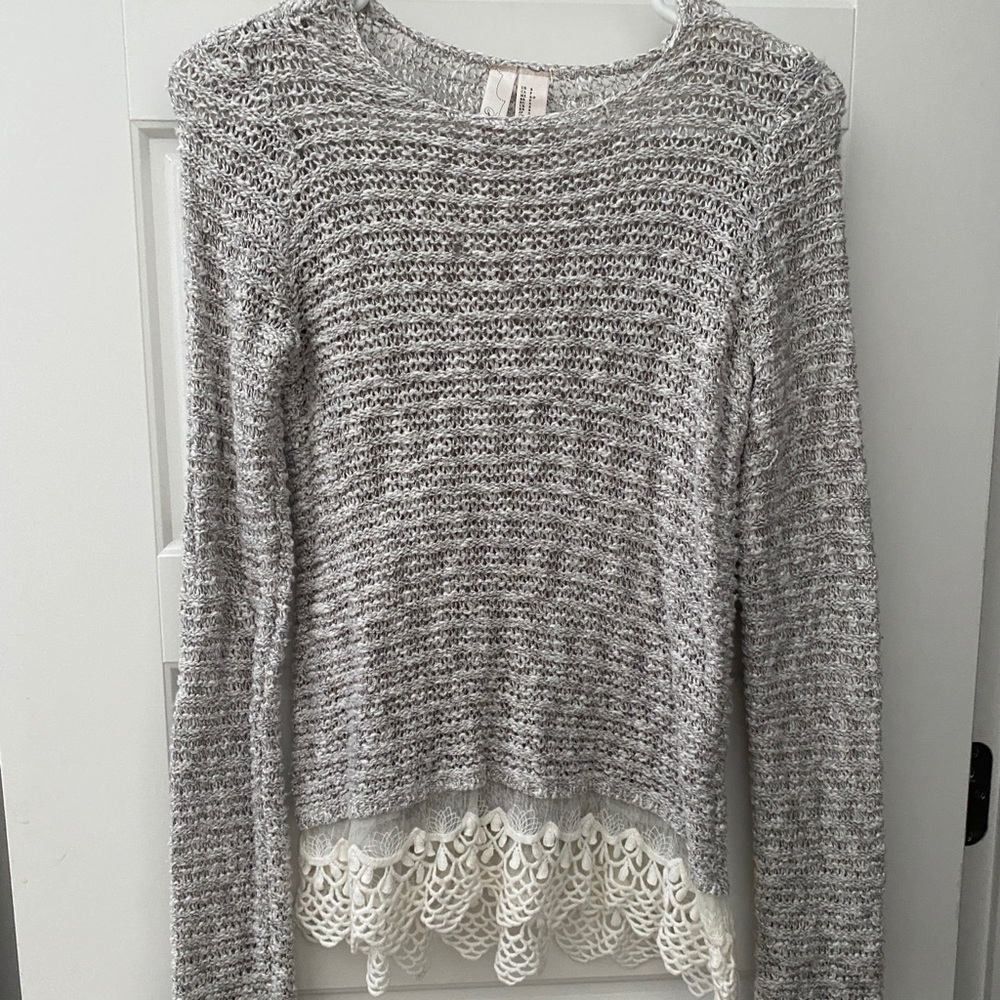 knitted sweater with lace on the bottom